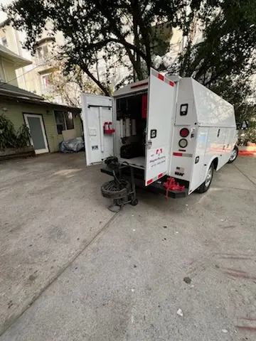 Magnet Plumbing service vehicle on-site for Grease Trap Cleaning in Gulf Park Estates